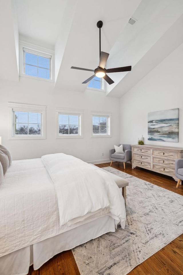 bedroom featuring wood-type flooring, vaulted ceiling, and ceiling fan