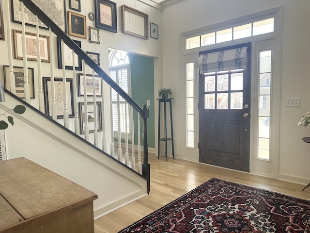 entryway featuring a healthy amount of sunlight and wood-type flooring