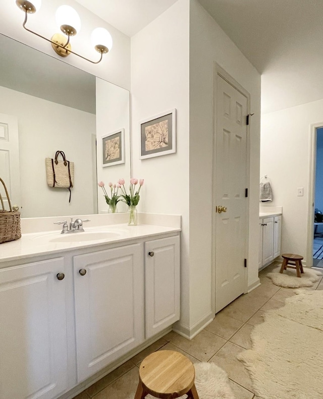 bathroom featuring vanity and tile patterned flooring