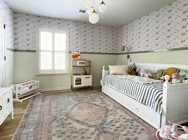 bedroom with hardwood / wood-style floors