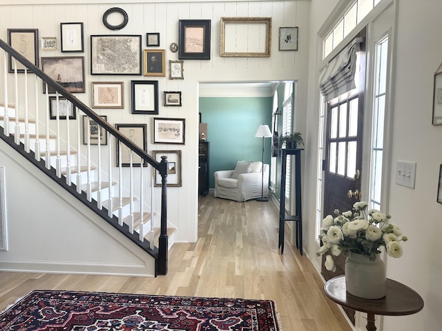 stairway with hardwood / wood-style flooring