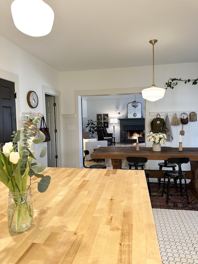 dining space featuring a fireplace