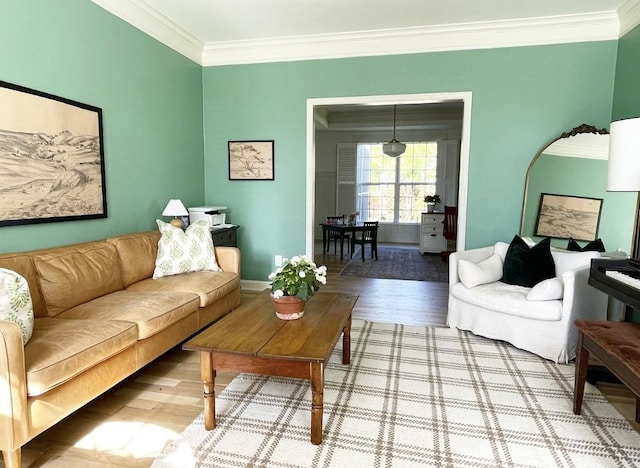 living room featuring crown molding and wood-type flooring