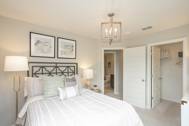 bedroom with light carpet and a chandelier