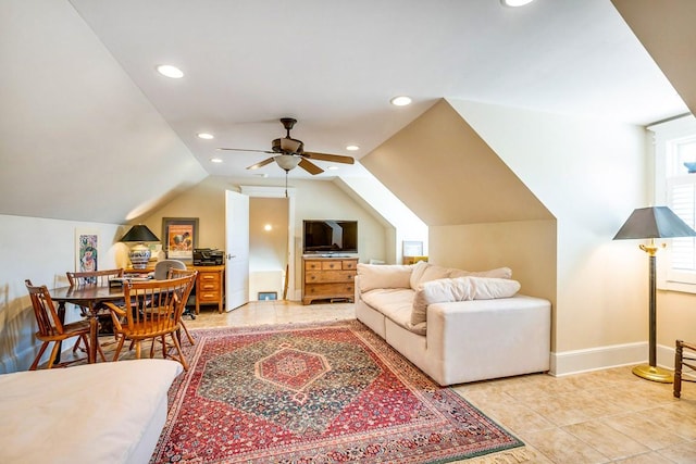 tiled living room with lofted ceiling and ceiling fan