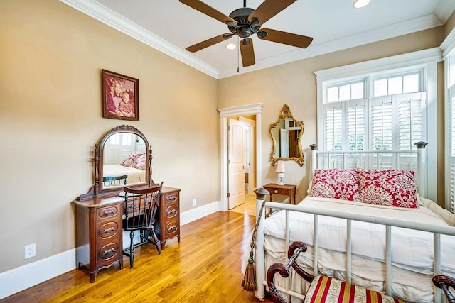 bedroom with hardwood / wood-style floors and crown molding