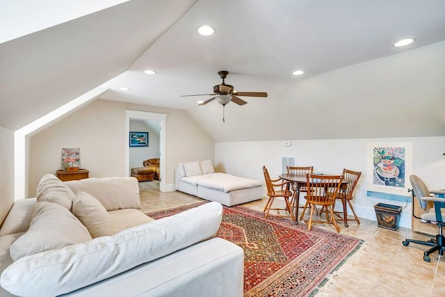 living room with ceiling fan and lofted ceiling