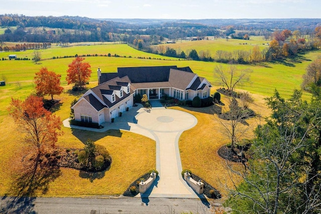 birds eye view of property featuring a rural view