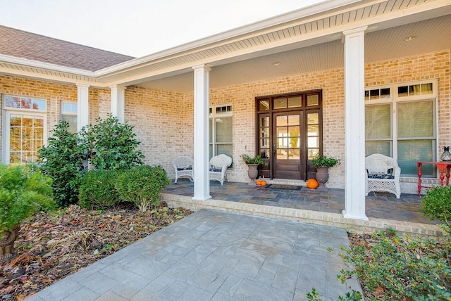 doorway to property featuring covered porch