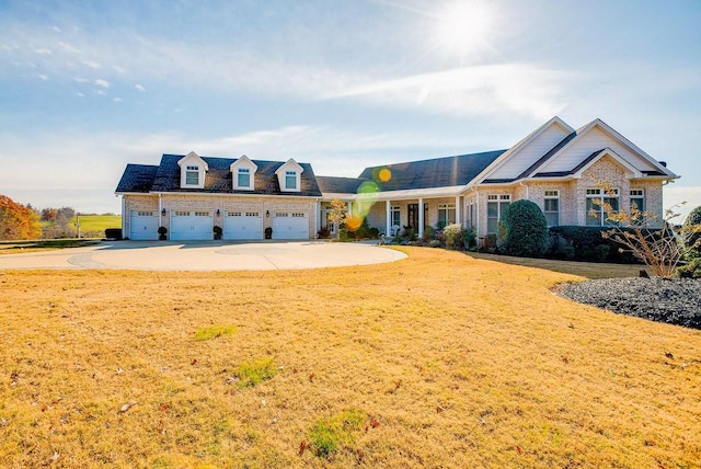 view of front facade with a garage and a front lawn