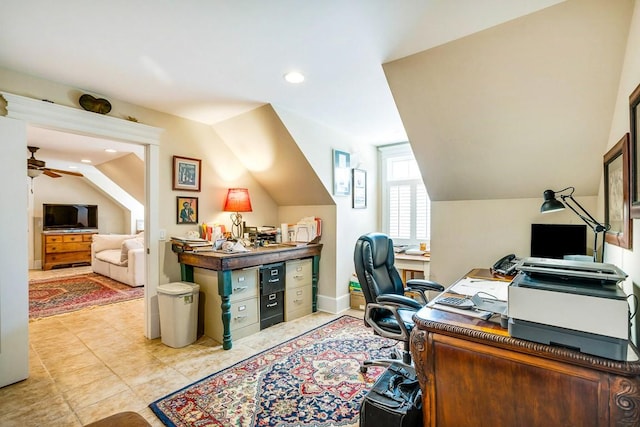 office area featuring vaulted ceiling and ceiling fan