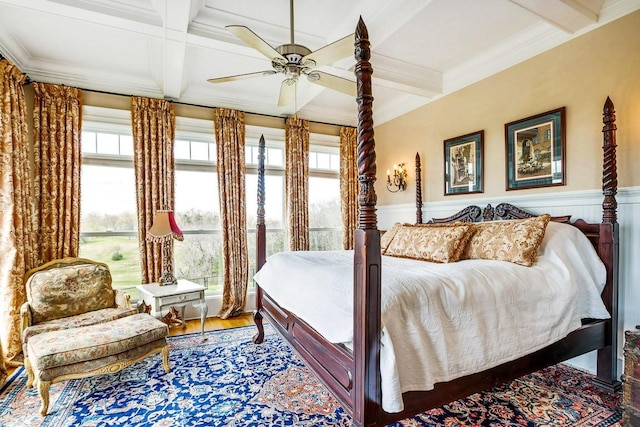 bedroom featuring coffered ceiling, hardwood / wood-style flooring, ornamental molding, and beamed ceiling