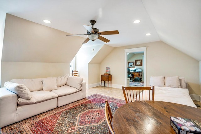 living room with ceiling fan and lofted ceiling