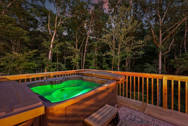 wooden deck featuring a hot tub