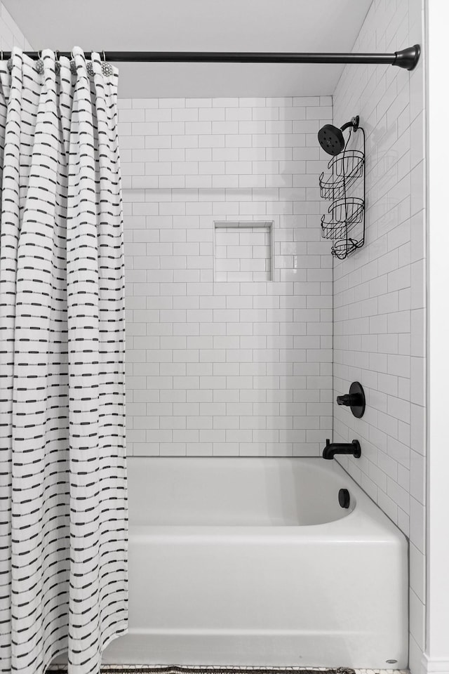 bathroom with shower / tub combo with curtain