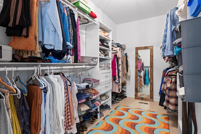 spacious closet featuring light hardwood / wood-style flooring