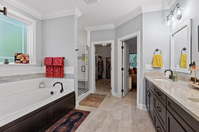 bathroom featuring vanity, ornamental molding, and shower with separate bathtub