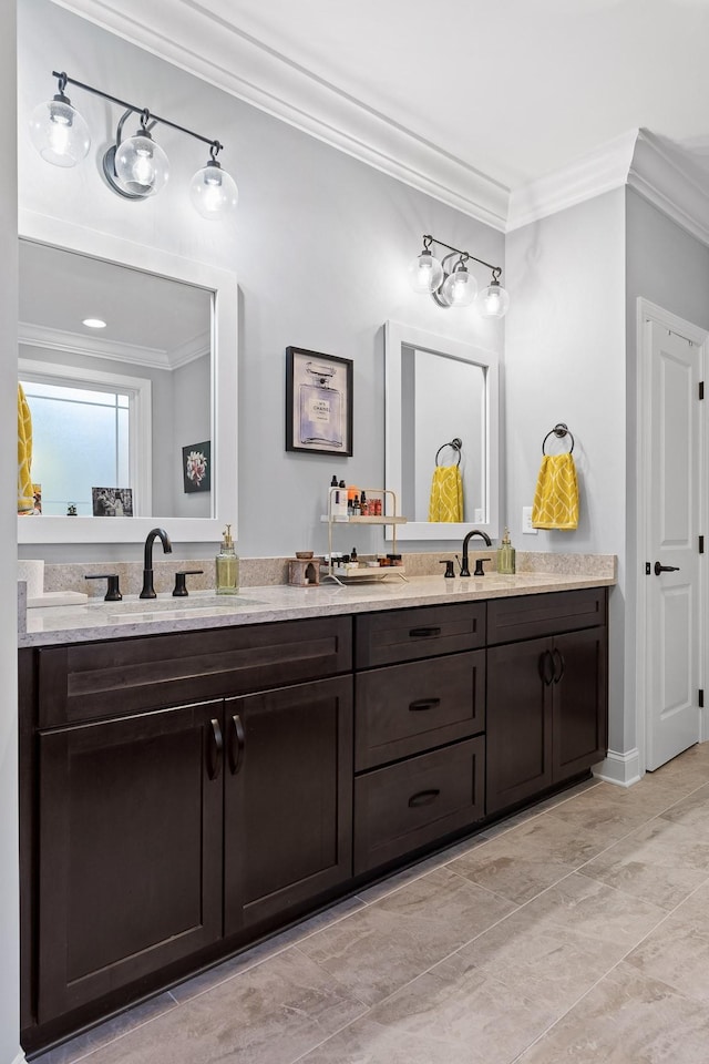 bathroom featuring ornamental molding and vanity