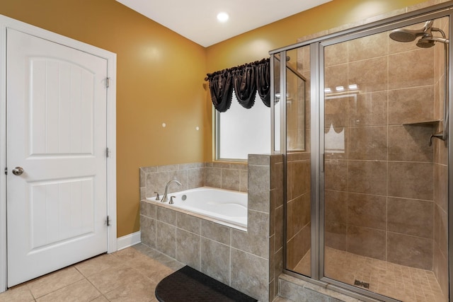 bathroom with separate shower and tub and tile patterned flooring