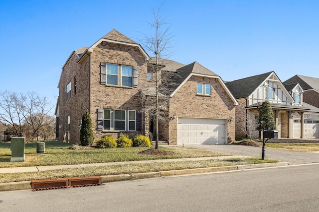 view of front of property with a garage and a front yard