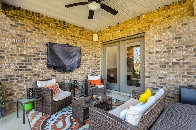 view of patio with outdoor lounge area, french doors, and ceiling fan