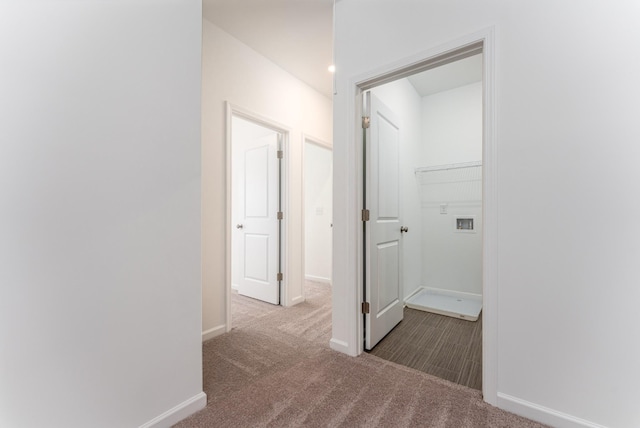 hallway with carpet flooring