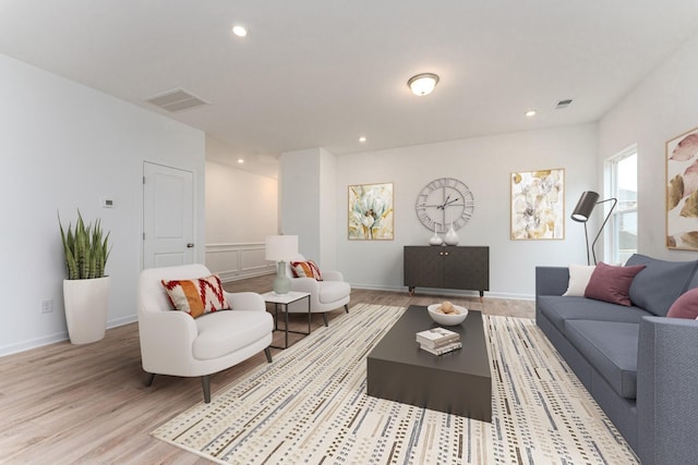 living room with light hardwood / wood-style flooring