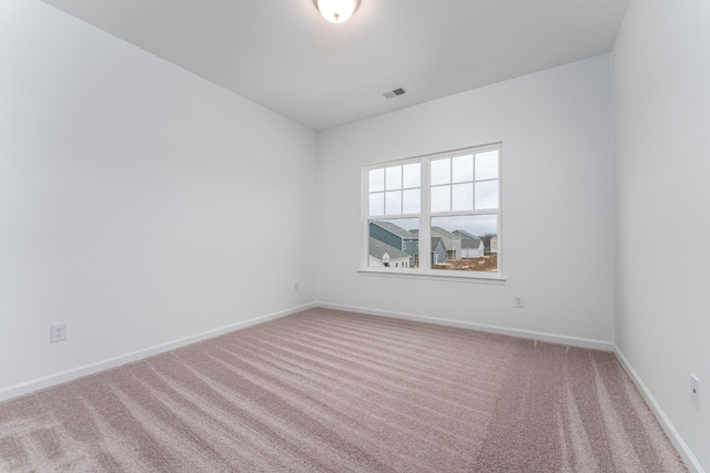 spare room with carpet floors