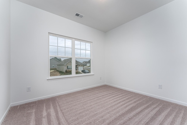 spare room featuring carpet floors