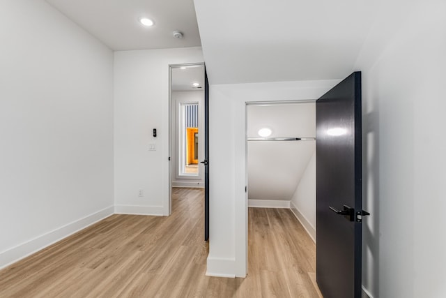 unfurnished bedroom with light wood-type flooring