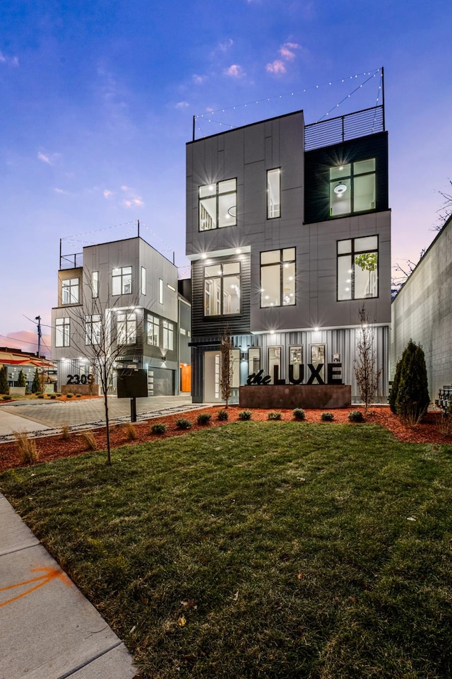 view of front of house with a yard