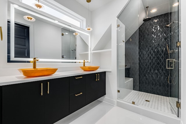 bathroom featuring vanity and an enclosed shower