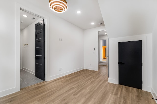 spare room featuring light wood-type flooring