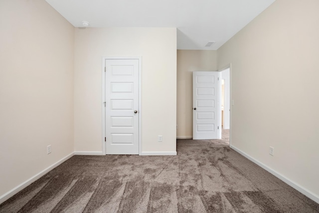 unfurnished bedroom featuring light colored carpet