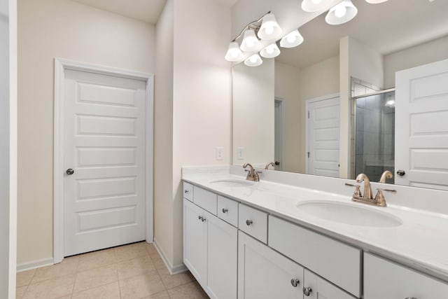 bathroom featuring vanity, an enclosed shower, and tile patterned flooring