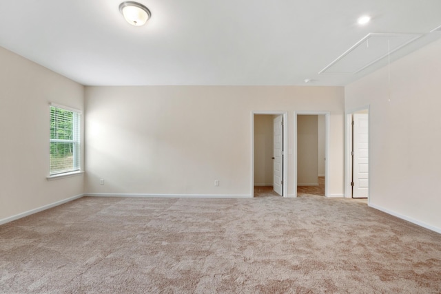 unfurnished room with light colored carpet