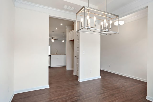 unfurnished dining area featuring dark hardwood / wood-style flooring, ceiling fan with notable chandelier, and ornamental molding