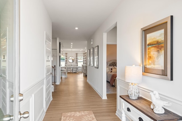 hall with light hardwood / wood-style floors