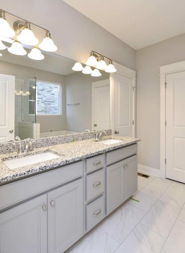 bathroom with vanity and an enclosed shower