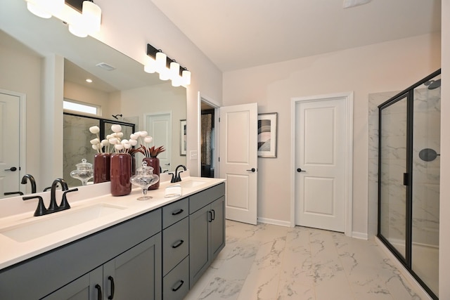 bathroom featuring vanity and a shower with shower door