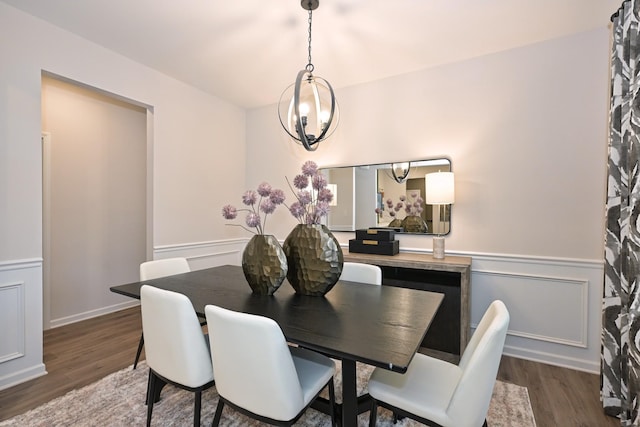 dining space with dark hardwood / wood-style flooring