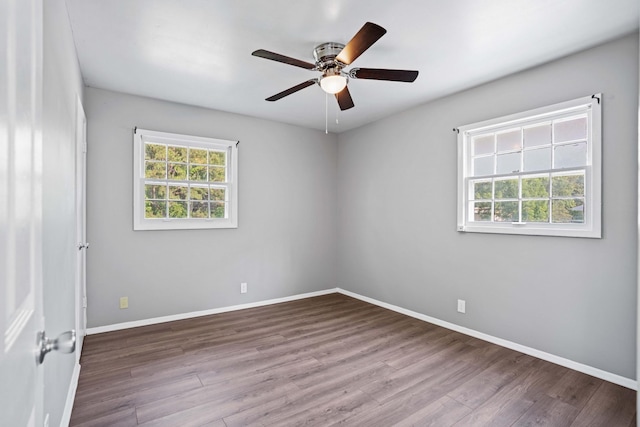 unfurnished room featuring hardwood / wood-style floors and ceiling fan