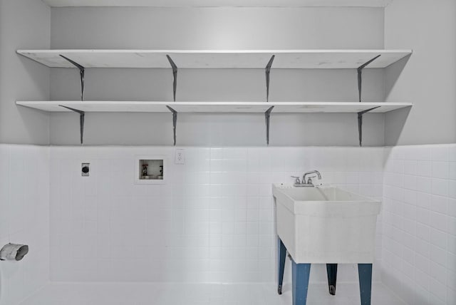 washroom featuring tile walls, hookup for a washing machine, and hookup for an electric dryer