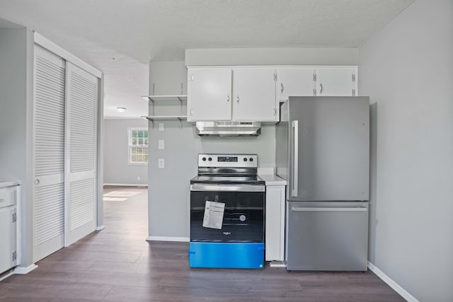 kitchen featuring white cabinetry, appliances with stainless steel finishes, dark hardwood / wood-style flooring, and a textured ceiling