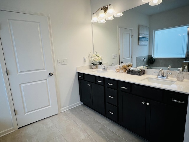 bathroom with tile patterned floors and vanity