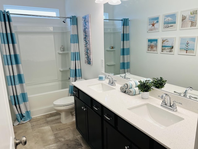 full bathroom with vanity, toilet, and shower / tub combo with curtain