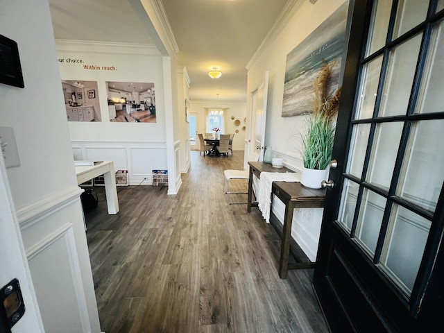 hall featuring ornamental molding and dark hardwood / wood-style floors