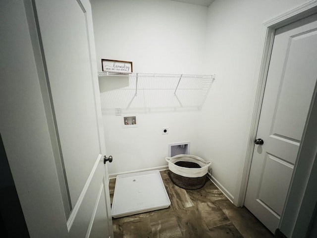 clothes washing area featuring dark wood-type flooring, washer hookup, and hookup for an electric dryer