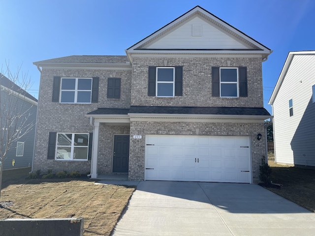 view of front of property with a garage