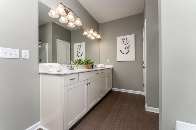 bathroom featuring vanity and a shower with door